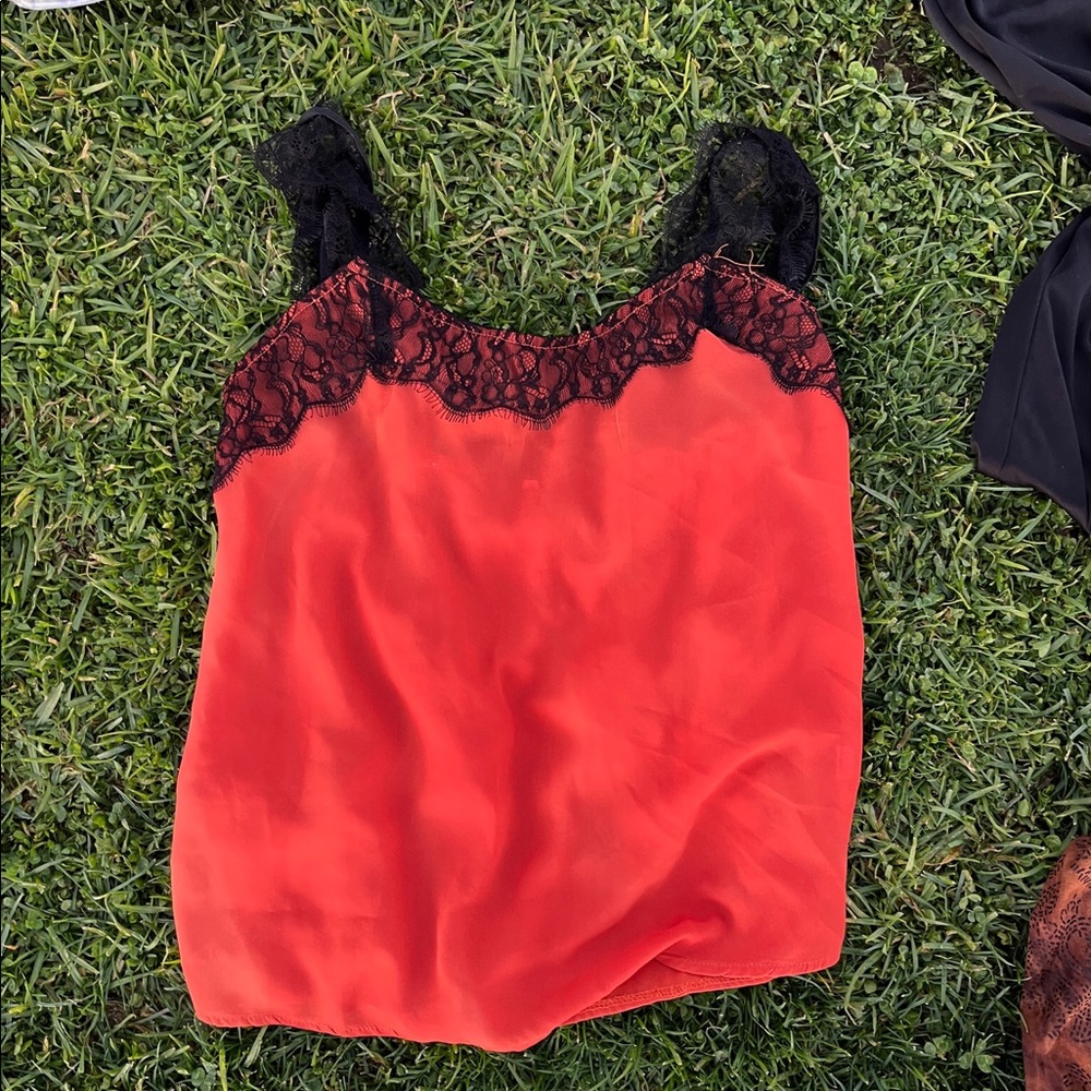 Thrifted orange top with black lace straps